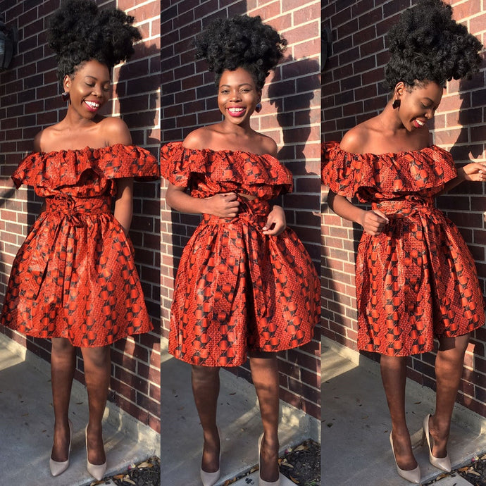 orange and black veroex off shoulder top and skirt